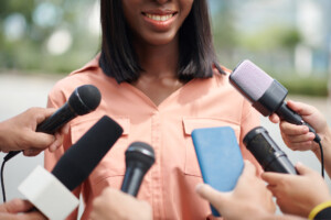 Smiling Politician Talking To Press